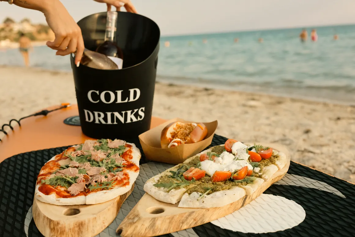 Flatbreads, a hot dog and cold drinks served at Moana Beach Bar on Arogi Beach